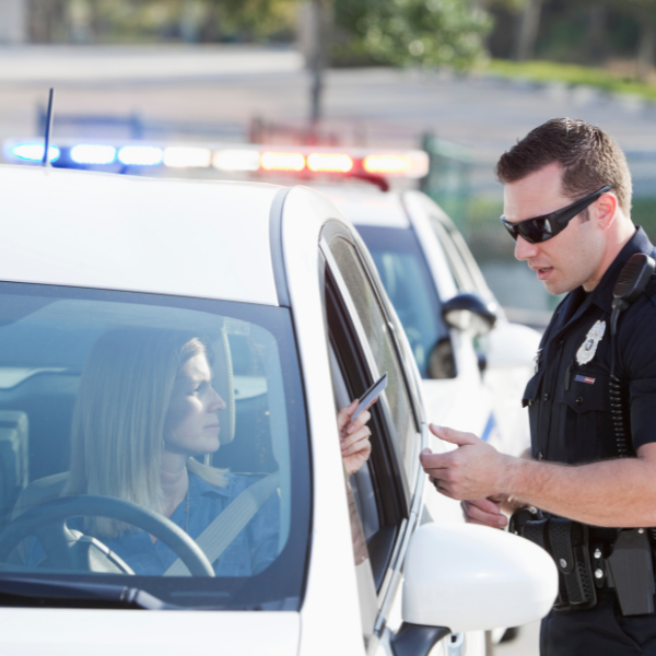 police officer checking female driver id